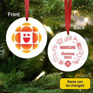 Christmas ornament with CBC Kids logo on front and personalized text on back, hanging on a tree.